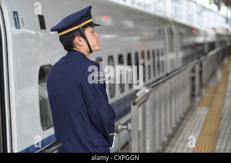 The driver/guard of a bullet train in Japan. Stock Photo
