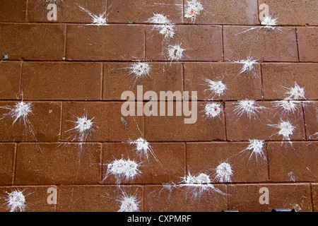 Red brick wall with white splat marks, background pattern Stock Photo