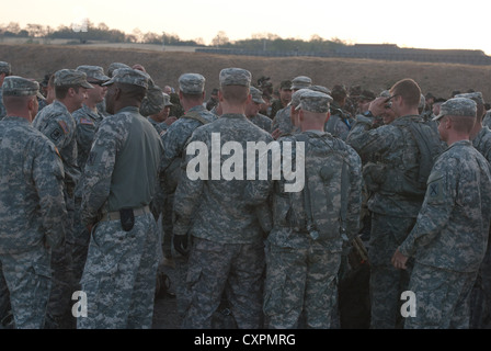 Soldiers from Bravo Company, 1st Battalion, 118th Infantry Division gather before the start of the Danish Contingency March. Three of the 118th Soldiers were among the first five to complete the 25.85-kilometer ruck march that started and stopped at Camp Novo Selo, Kosovo. Stock Photo