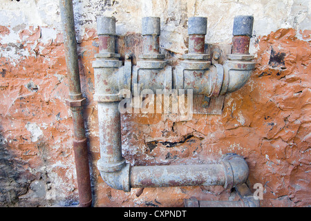 Old Water Pipes Plumbing in Abandoned Hydroelectic Power Station Stock Photo