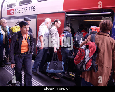 Passengers board train in Visp station, Switzerland Stock Photo