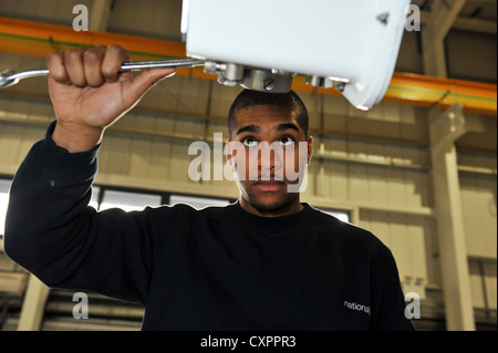 Young Apprentice training to be a technician for a Power company Stock Photo