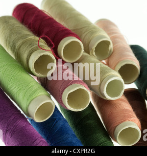 Pile of reels of coloured polyester thread Stock Photo