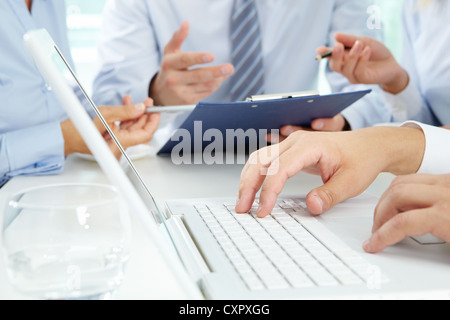 Close-up of male hands typing on the laptop keyboard Stock Photo