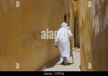 Man in narrow lane of old medina, Fes, Morocco