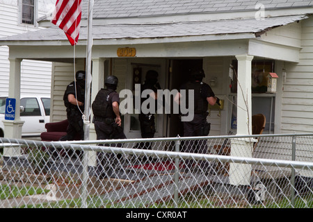 Police Tactical Team serving a high risk drug-related search warrant in ...