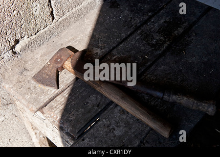 Old grungy ax and sickle Stock Photo