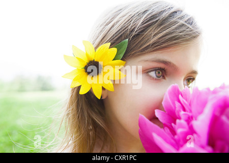 Girl with pink flower Stock Photo