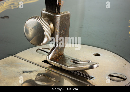 Close up of an old antique sewing machine foot Stock Photo