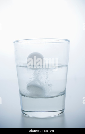 Pill in glass of water Stock Photo