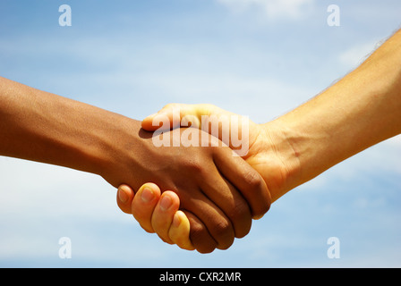Two young businessmen shaking hands Stock Photo