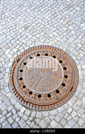 cast cover on pavement Berlin Germany Stock Photo