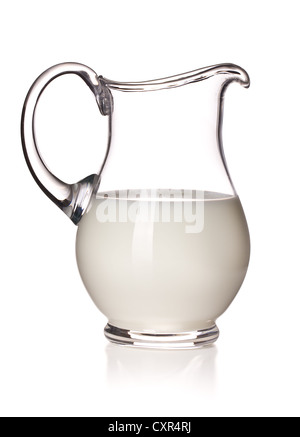milk in a glass pitcher on white background Stock Photo