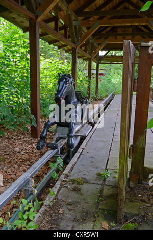 Morbid charm of an abandoned funfair ride in the former Spreepark Berlin amusement park, formerly known as Kulturpark Stock Photo