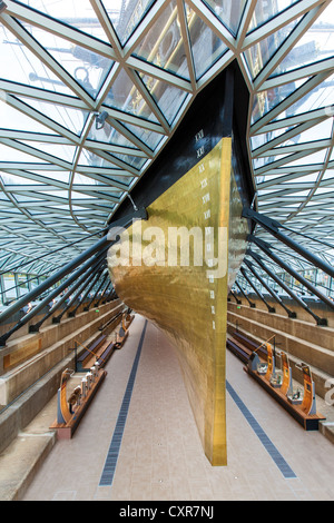 The golden stern of the Cutty Sark an original tea clipper vessel from the 1800's, showing roman numeration on the bow scale Stock Photo