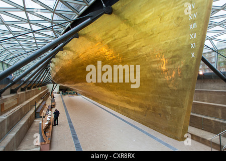 The golden hull of the Cutty Sark an original tea clipper vessel from the 1800's Stock Photo