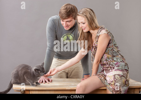 Young couple with cat Stock Photo