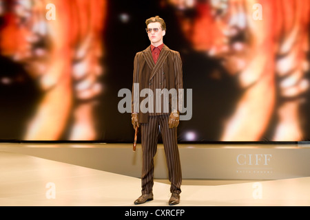 Young man presenting modern striped suit, Copenhagen International Fashion Fair, Copenhagen, Denmark, Europe Stock Photo