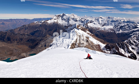 Mountaineer with rope descending from Mt Nevado Tocllaraju, Cordillera Blanca mountain range, Peru, South America Stock Photo