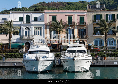 Two yachts moored in front of a row of houses, Casamicciola Terme, Ischia Island, Gulf of Naples, Campania, Southern Italy Stock Photo