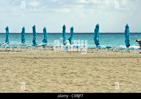 Sun loungers on the beach at South Beach, Miami, Florida, USA Stock Photo