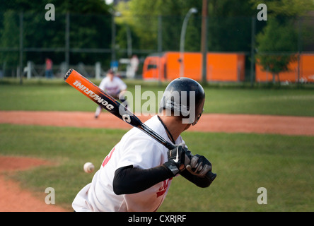 Baseball player hitting ball, Berlin, Germany, Europe Stock Photo