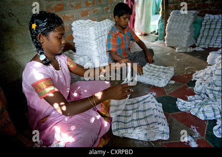 Girl, 13 years, and boy working in a towel production, child labourers, Karur, Tamil Nadu, South India, India, Asia Stock Photo