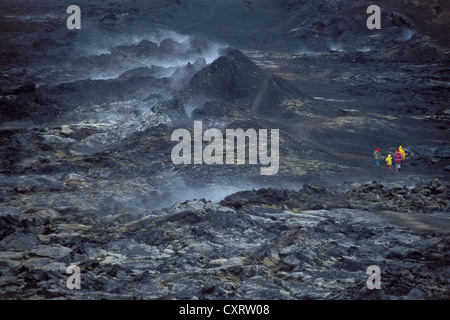 Visitors wearing coloured clothing in the lava fields of Leirhnjúkur Volcano, Krafla, M vatn, northern Iceland, Iceland, Europe Stock Photo