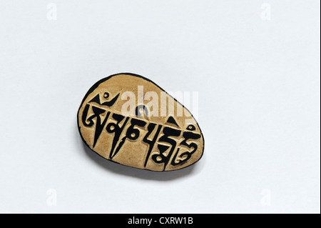 Ma ni rdo, Tibetan for mani stone, a souvenir from Tibet bearing the inscription, Om mani padme hum, which translates to Oh Stock Photo