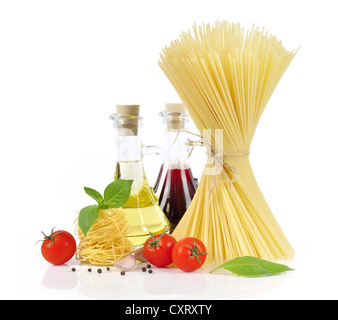 Italian Pasta with tomatoes, olive oil and basil on a white background  Stock Photo