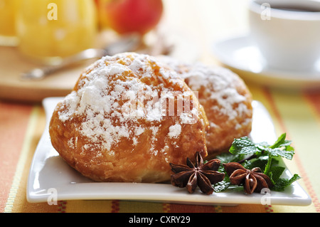 Two buns with apple stuffing on plate with mint closeup. Small shallow dof. Stock Photo