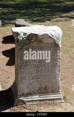 Greek inscription on stone column, Ancient Olympia, Elis, West Greece Region, Greece Stock Photo