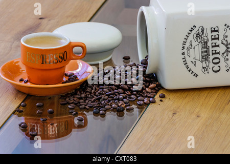 Espresso coffee with coffee beans on a wooden table Stock Photo