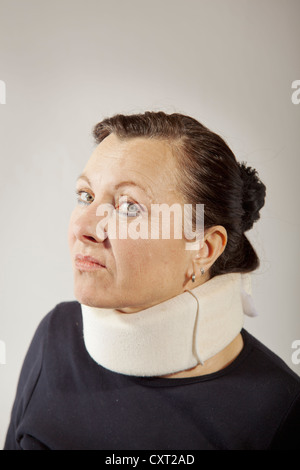 Caucasian blonde adult 30s female woman wearing a cervical collar