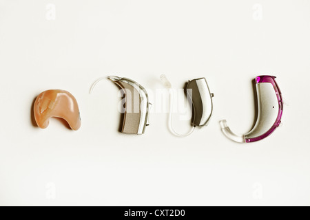 Different hearing aid devices Stock Photo