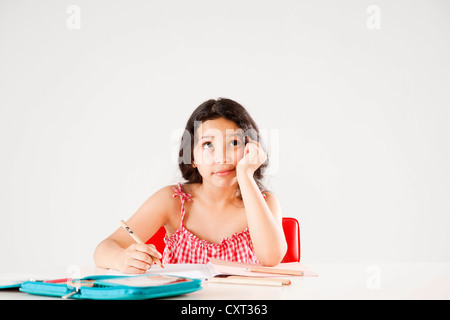 Girl doing her homework, learning Stock Photo