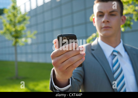Young businessman with a mobile phone Stock Photo