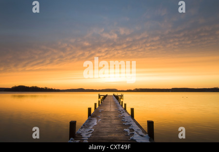 Wooden pier on Lake Woerth at sunrise, Bavaria, Germany, Europe Stock Photo