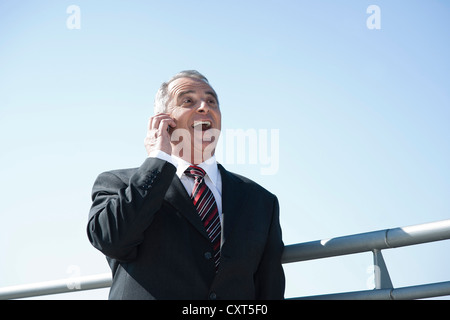 Businessman talking on his smartphone Stock Photo