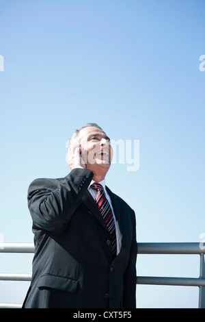 Businessman talking on his smartphone Stock Photo