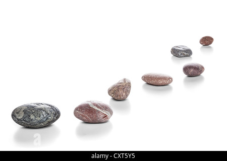 Stepping Stones or pebbles on a white background with soft natural shadow. Focus stack, in focus front to back. Stock Photo