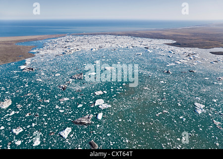 Aerial view, icebergs and ice floes piling up in the Joekulsarlon glacier lagoon on their way to the sea, south side of the Stock Photo