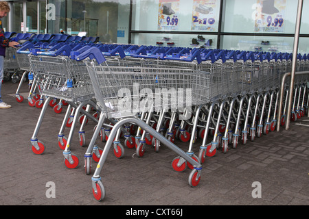 Tesco shopping trolleys outside their store in Bradley Stoke, Bristol, England, UK Stock Photo