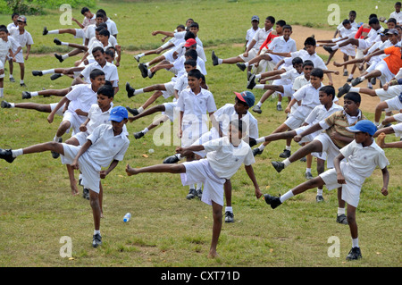 Karate training, boys wearing white school uniforms, Galle, Sri Lanka, Ceylon, Asia, PublicGround Stock Photo