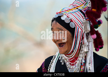 Smiling woman with headdress of the Akha hill tribe, ethnic minority, Northern Thailand, Thailand, Asia Stock Photo