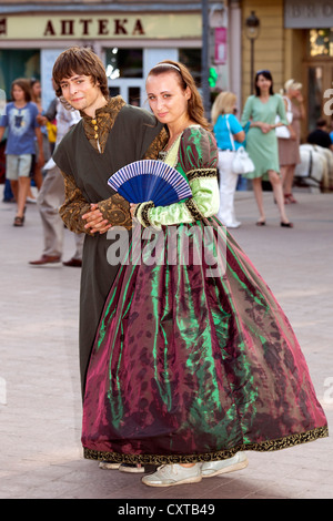 Couple in traditional costumes, L'viv old town, Ukraine Stock Photo