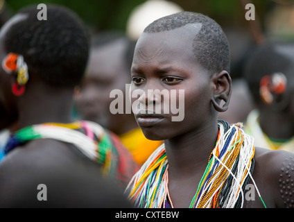 Suri Tribe Girl With Enlarged Earlobe At A ceremony organized by the government, Kibish, Omo Valley, Ethiopia Stock Photo