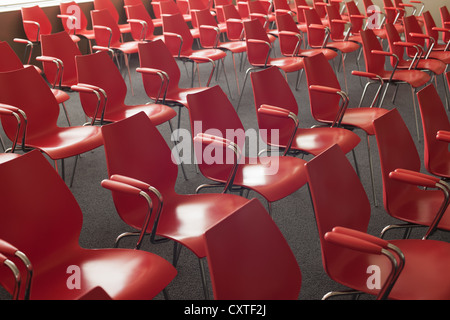 Empty red chairs in room Stock Photo
