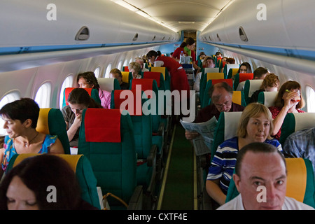 Passengers on flight, Austrian Airlines Stock Photo