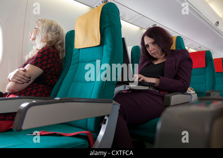 Passenger on flight, Austrian Airlines Stock Photo
